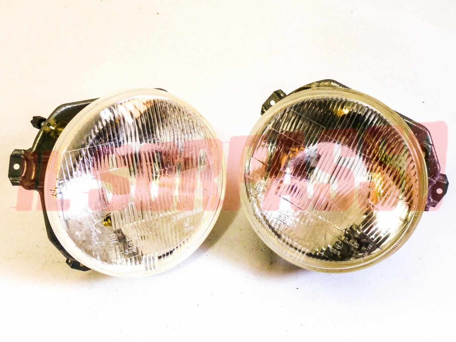 GRUPPI OTTICI FANALI GHIERE FARI VOLKSWAGEN GOLF + CABRIO MK1 ORIGINALI CARELLO