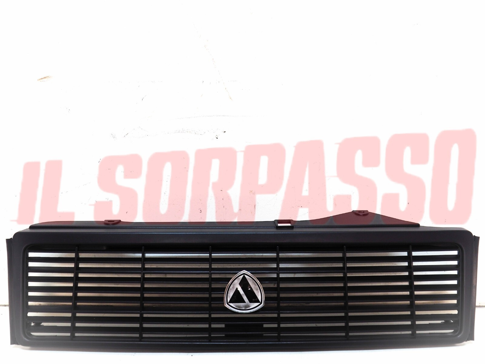 MASCHERINA GRIGLIA + STEMMA AUTOBIANCHI Y10 1 SERIE