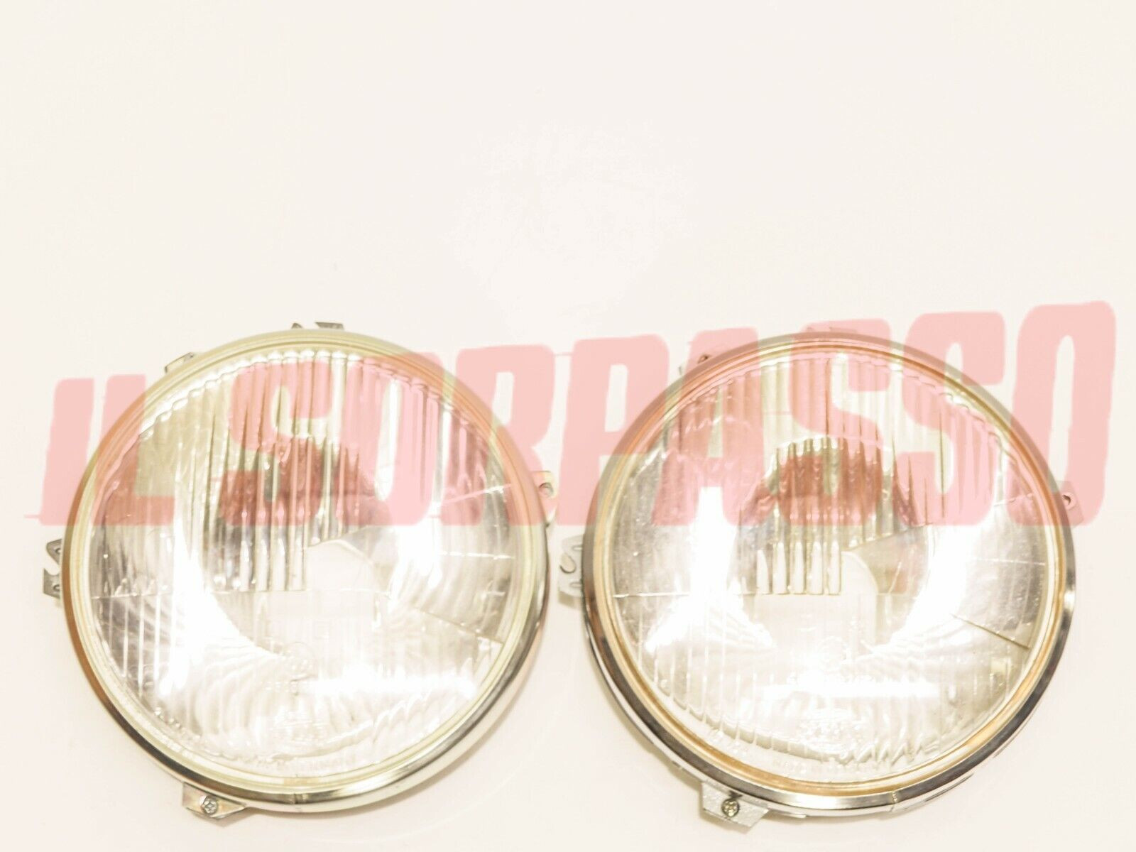 GRUPPI OTTICI FANALI FARI FORD ESCORT ORIGINALI HELLA